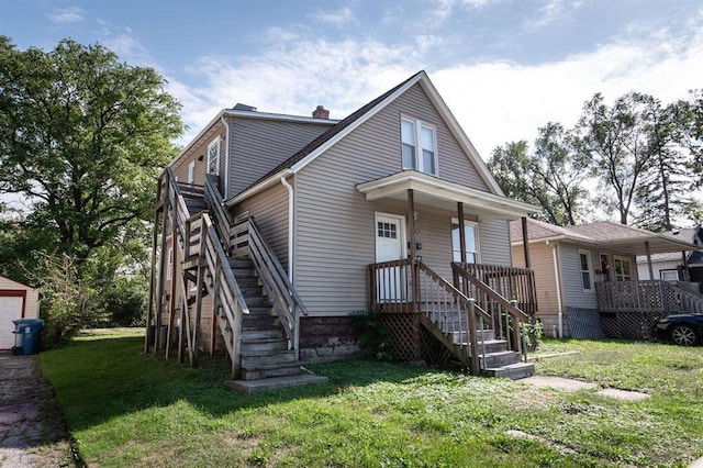 bungalow-style house featuring a front yard