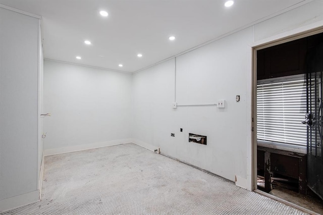 carpeted empty room featuring crown molding