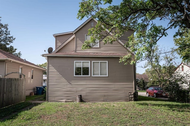 view of side of property featuring a yard