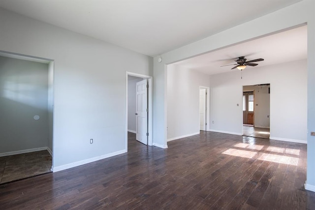 empty room featuring dark hardwood / wood-style flooring and ceiling fan