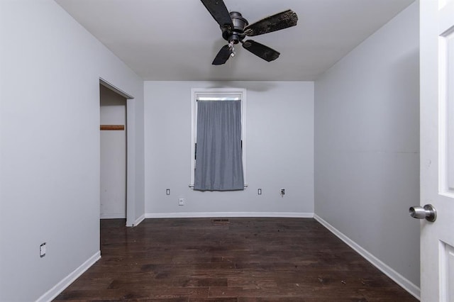 unfurnished bedroom with dark hardwood / wood-style floors and ceiling fan