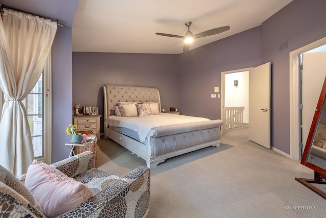 carpeted bedroom featuring access to exterior and ceiling fan