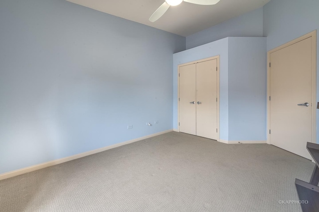 unfurnished bedroom with ceiling fan, a closet, and carpet floors