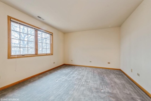 unfurnished room with light carpet