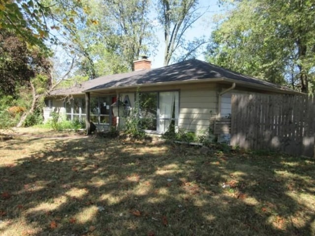 back of house with a sunroom