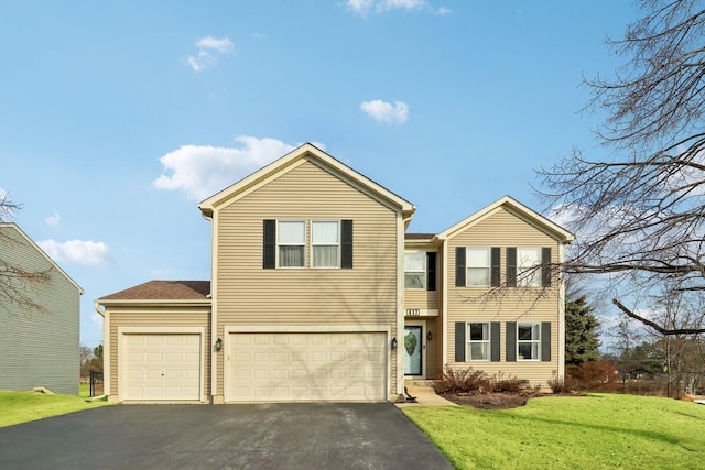 view of front facade featuring a garage and a front lawn