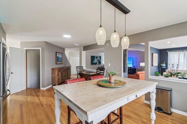 dining area with light wood-type flooring