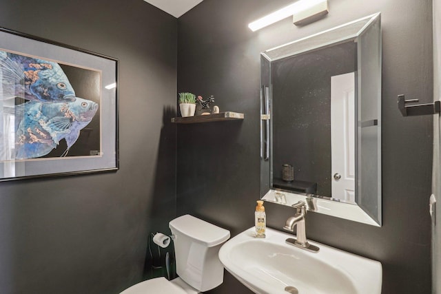 bathroom featuring sink and toilet