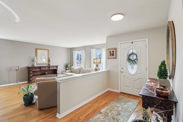 entrance foyer with plenty of natural light and hardwood / wood-style floors