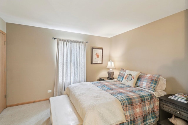 bedroom featuring light carpet