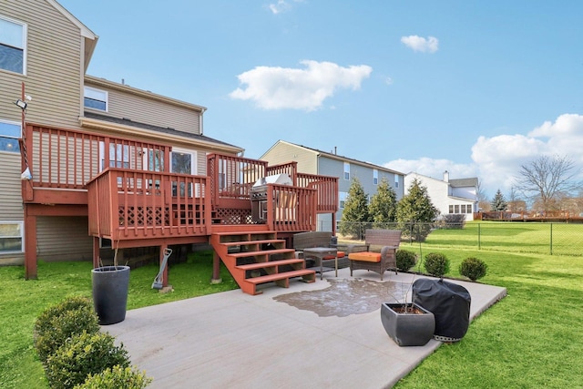 rear view of property with a wooden deck, an outdoor living space, a patio, and a yard