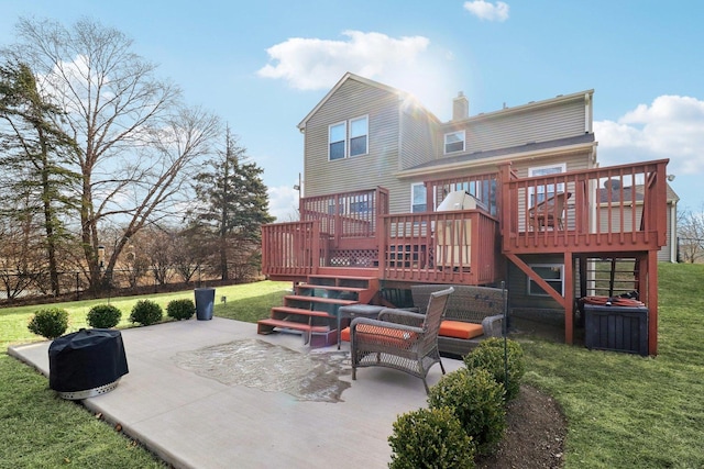 rear view of house with a lawn, a patio, and a deck