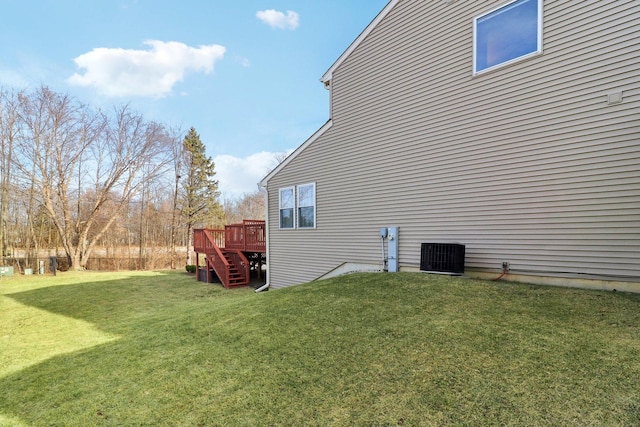 view of property exterior featuring cooling unit, a yard, and a deck