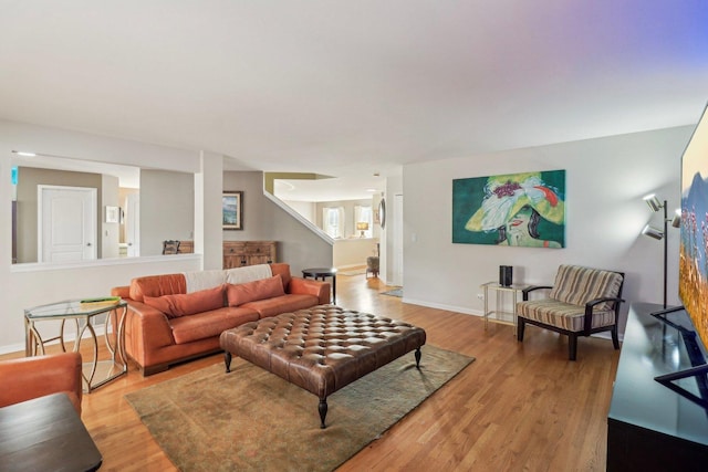 living room with light hardwood / wood-style flooring