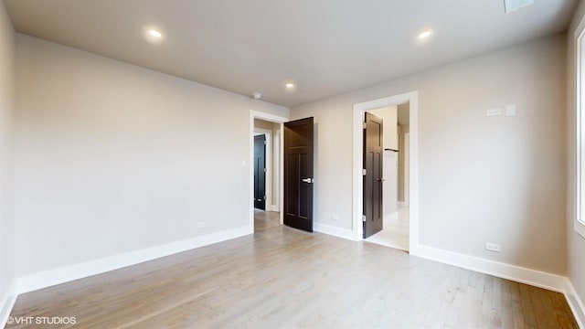 unfurnished room featuring light hardwood / wood-style flooring