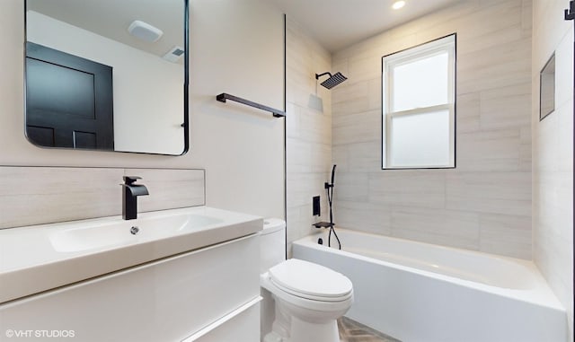 full bathroom featuring vanity, tiled shower / bath combo, toilet, and backsplash