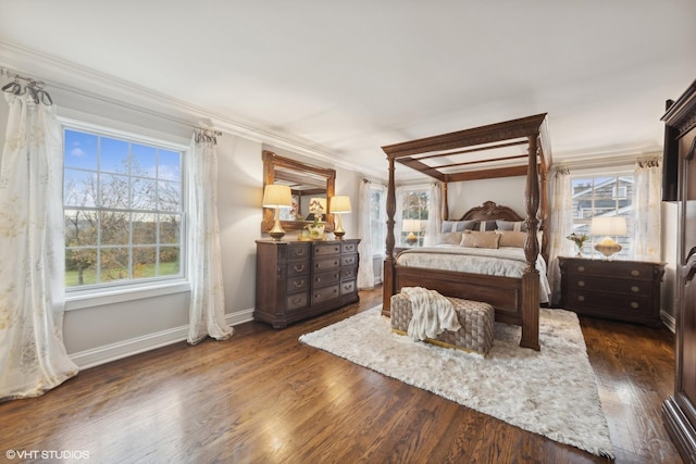 bedroom featuring dark hardwood / wood-style floors and crown molding