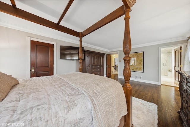 bedroom featuring ornamental molding, connected bathroom, and dark wood-type flooring