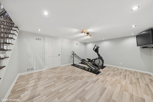 exercise area featuring light hardwood / wood-style floors