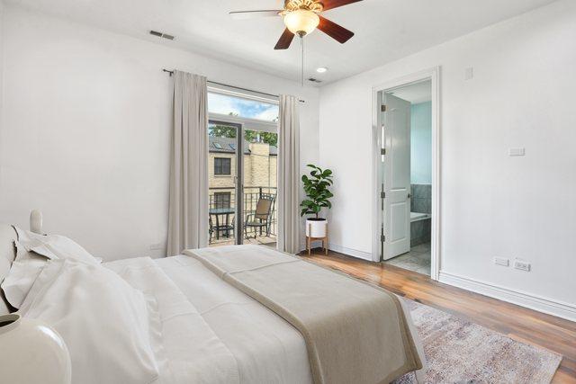 bedroom featuring access to exterior, hardwood / wood-style floors, connected bathroom, and ceiling fan