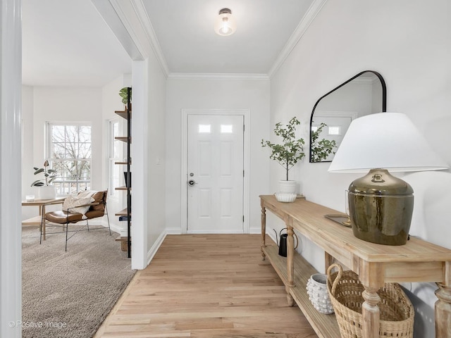 entrance foyer with light wood-type flooring and crown molding