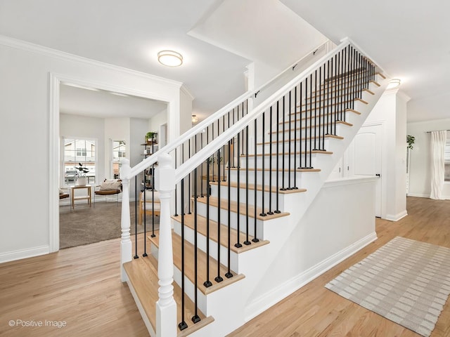 stairs featuring hardwood / wood-style floors