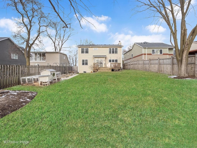 rear view of house with a lawn