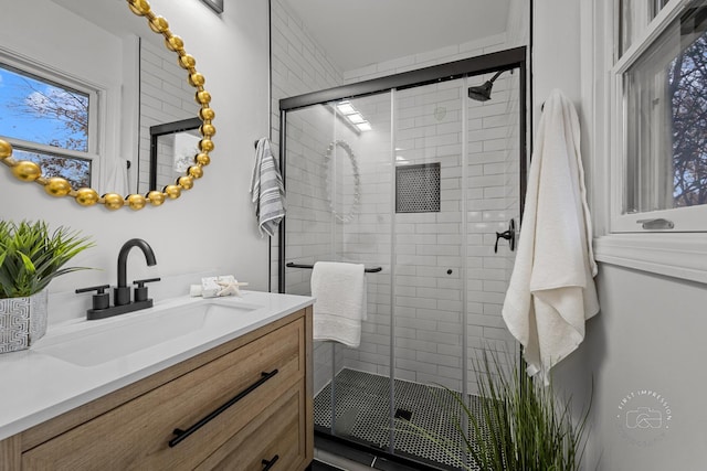 bathroom featuring vanity and walk in shower