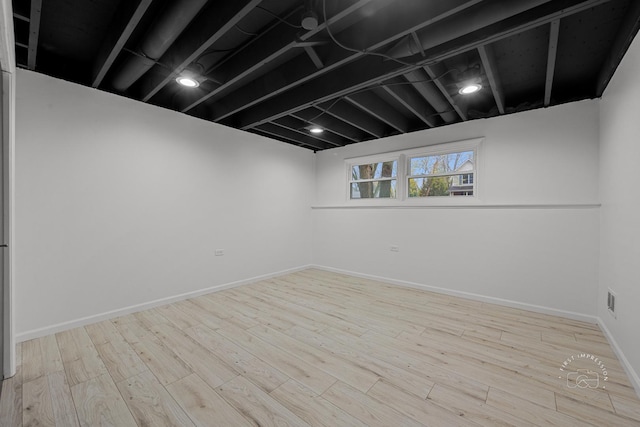 basement featuring light wood-type flooring