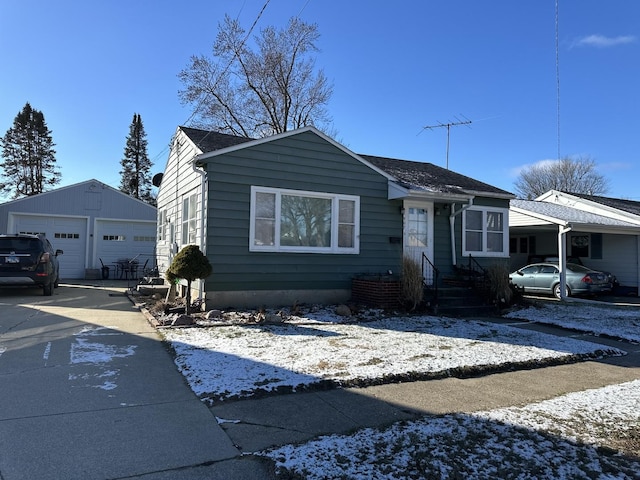 view of front of home with an outbuilding and a garage