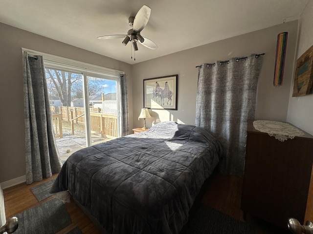 bedroom with access to outside, ceiling fan, and dark hardwood / wood-style floors