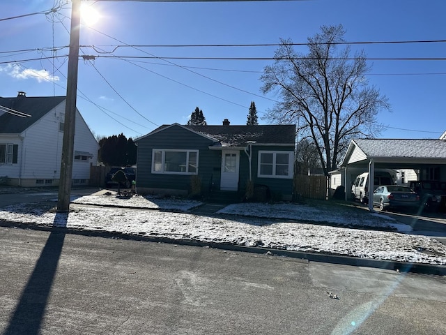 view of front of home with a carport