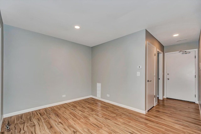 spare room with light wood-type flooring