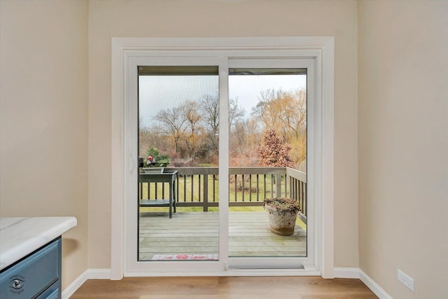 doorway with light hardwood / wood-style flooring