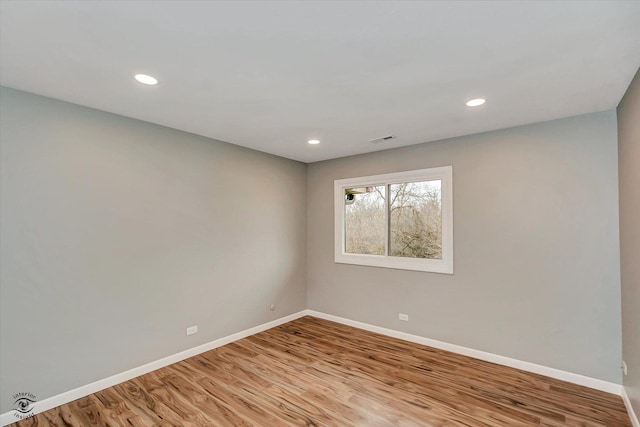 empty room with light hardwood / wood-style floors