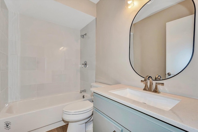 full bathroom featuring vanity, hardwood / wood-style flooring, toilet, and shower / bathtub combination