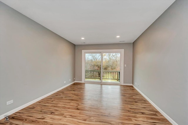 empty room with light wood-type flooring