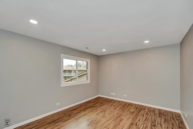 spare room featuring light hardwood / wood-style flooring