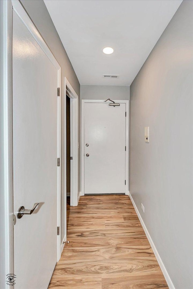 hallway featuring light hardwood / wood-style flooring