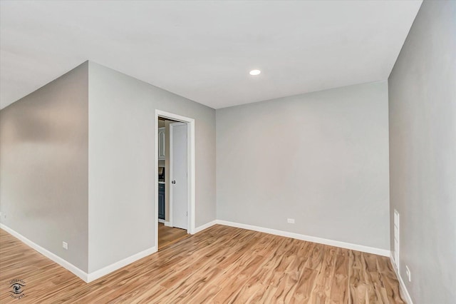 spare room with light wood-type flooring