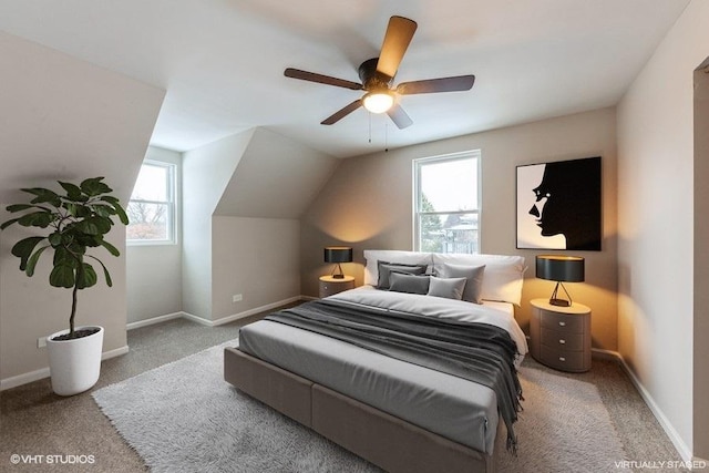 bedroom featuring ceiling fan, light carpet, and lofted ceiling