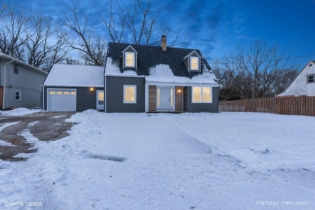 cape cod-style house with a garage