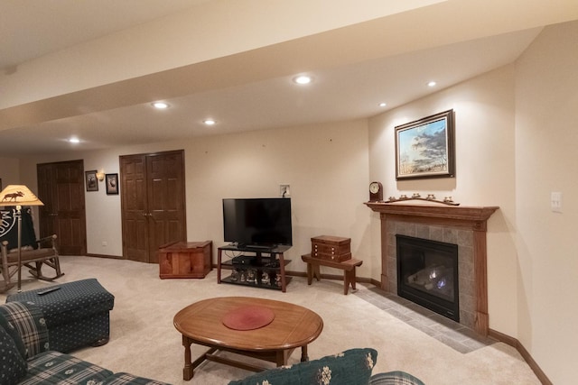 carpeted living room with a fireplace