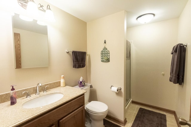 bathroom with toilet, tile patterned flooring, vanity, and walk in shower