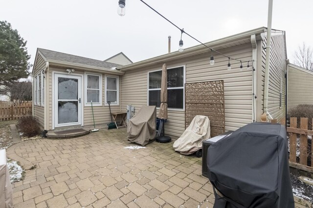 rear view of property featuring a patio