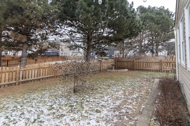 view of yard layered in snow