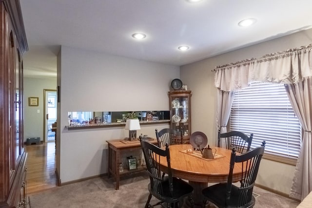 dining area with light carpet