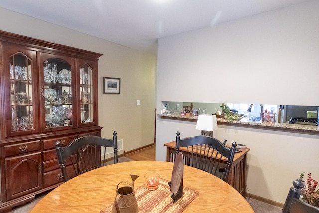 view of carpeted dining space