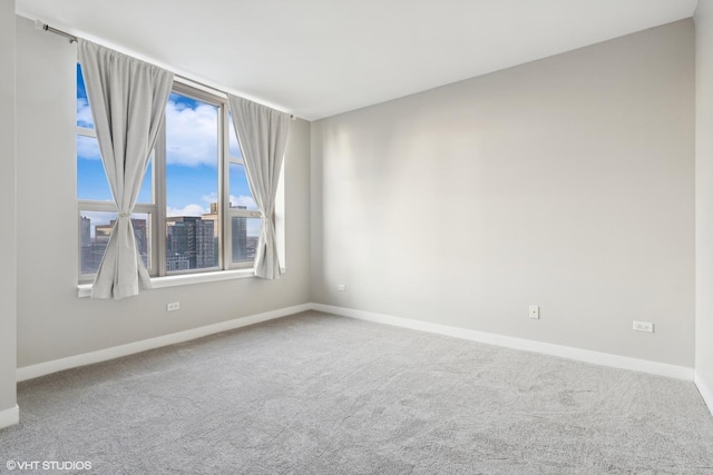 unfurnished room with carpet flooring