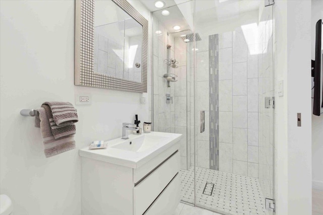 bathroom with vanity, tile patterned floors, and walk in shower